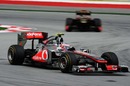 Jenson Button leads Nick Heidfeld through turns one and two