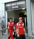 Fernando Alonso leaves the stewards' office after receiving a 20 second penalty for clashing with Lewis Hamilton