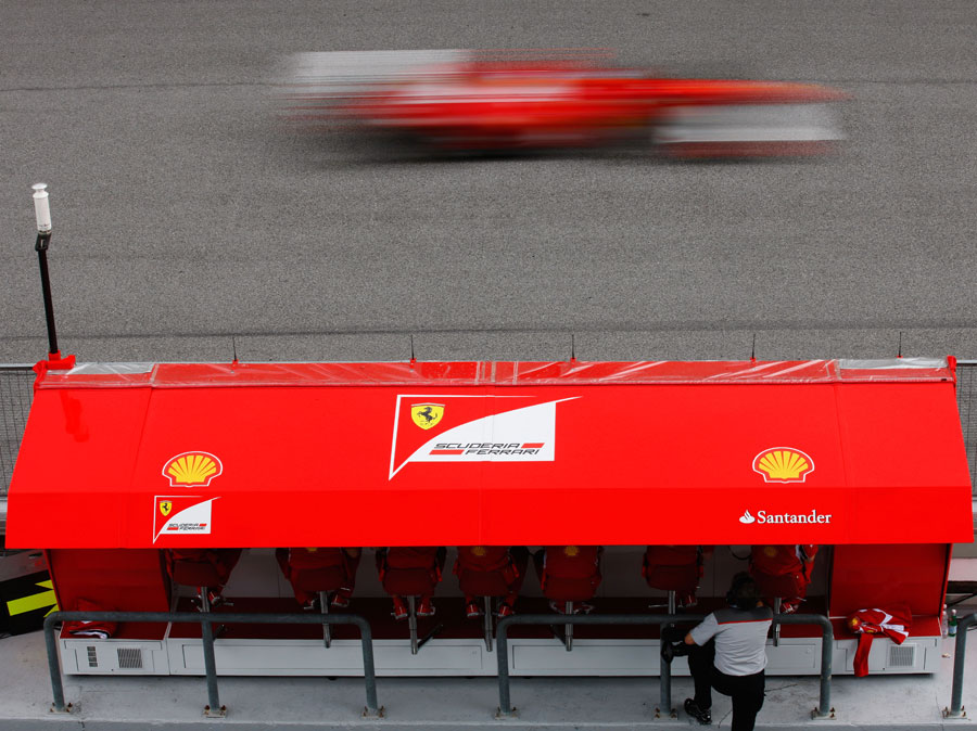 Ferrari monitors progress from the pit wall