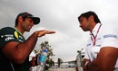 Karun Chandhok and Narain Karthikeyan catch up in the paddock on Friday