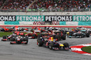 Sebastian Vettel leads the field through the first two corners