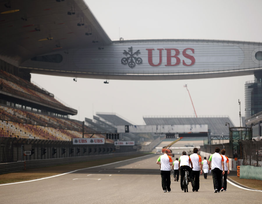 The Force India team walks the track on Thursday