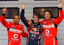 Sebastian Vettel celebrates pole position with Lewis Hamilton and Jenson Button