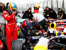 Fernando Alonso admires Sebastian Vettel's Red Bull after qualifying 