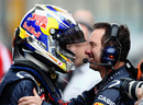 Sebastian Vettel celebrates pole position with Red Bull racing chief mechanic Kenny Handkammer