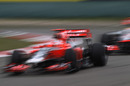 Timo Glock heads Lewis Hamilton during qualifying