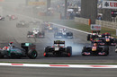 Vitaly Petrov locks up his tyres in the midst of a tight midfield battle