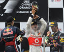 Lewis Hamilton celebrates victory on the podium