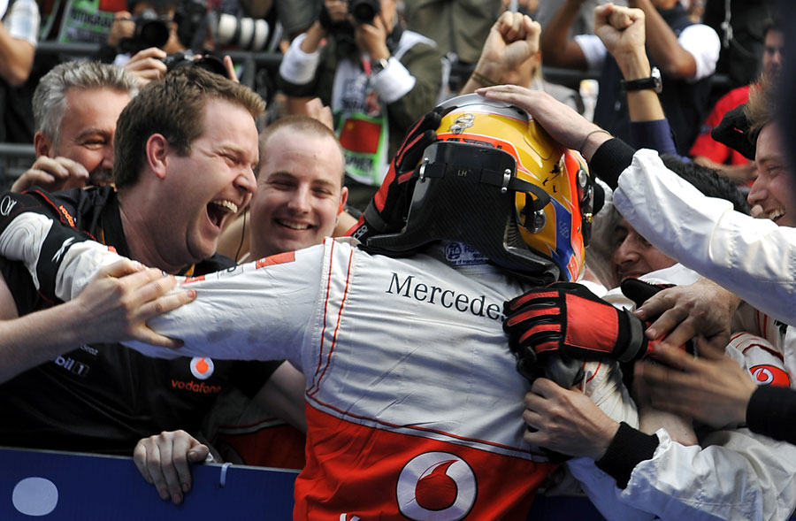 Lewis Hamilton thanks his mechanics after winning the race