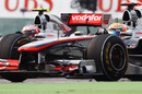 The McLarens of Jenson Button and Lewis Hamilton go wheel-to-wheel over second place 