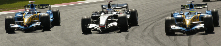 The Renaults of Juan Pablo Montoya and Giancarlo Fisichella sandwich  Kimi Raikkonen's McLaren on the opening lap