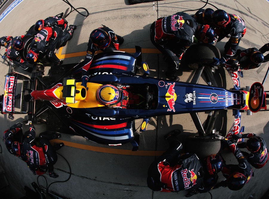 Mark Webber pits for a new set of soft tyres