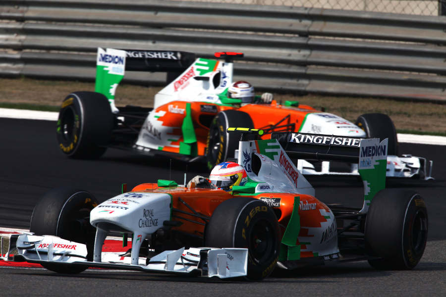 Paul di Resta leads Adrian Sutil round the hairpin