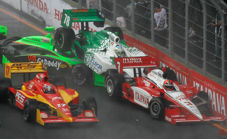 Helio Castroneves, Danica Patrick, and Simona De Silvestro crash during the start of the IndyCar's Sao Paulo 300