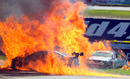 The cars of Steve Owen and Karl Reindler on fire after a major crash on the start line in race 2 during the V8 Supercar round at Barbagallo Raceway