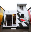 HRT's newly painted motorhome makes its debut in the paddock