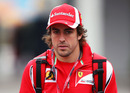 Fernando Alonso arrives in the paddock