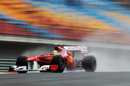 Felipe Massa flashes past empty grandstands