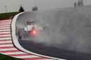 Sergio Perez heads uphill through the spray