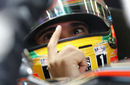 Lewis Hamilton talks to his engineer in the McLaren garage