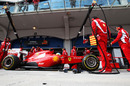Fernando Alonso stops outside the Ferrari garage