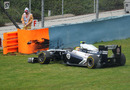 Pastor Maldonado damages his new front wing against the tyre wall having spun exiting turn 8
