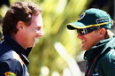 Christian Horner talks to Heikki Kovalainen in the paddock