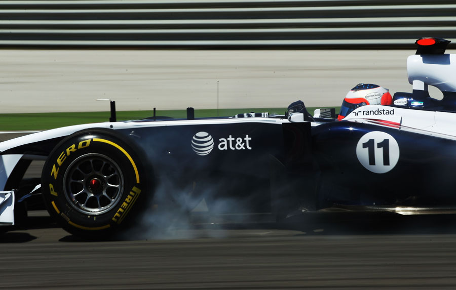 Rubens Barrichello locks a tyre under braking