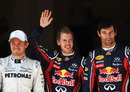 Sebastian Vettel celebrates taking pole position with Nico Rosberg and Mark Webber