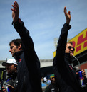 Mark Webber and Sebastian Vettel wave to the fans