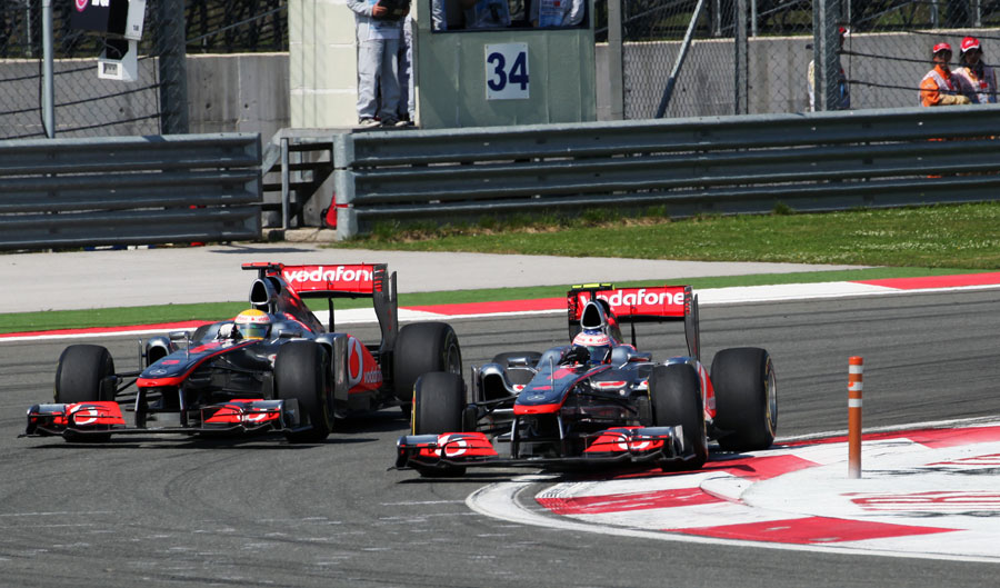 Jenson Button holds off Lewis Hamilton into turn 12