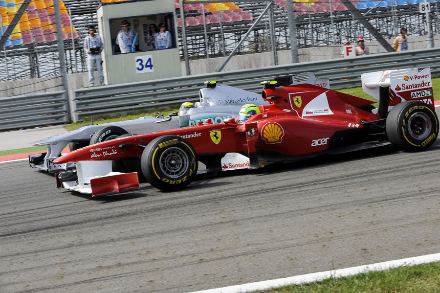 Felipe Massa goes wheel-to-wheel with Nico Rosberg