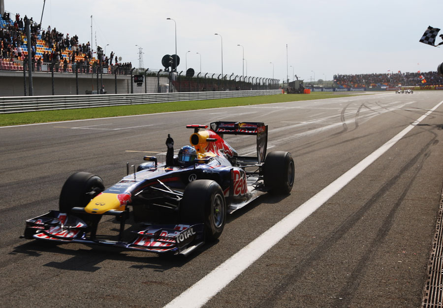 Sebastian Vettel crosses the line for his third victory of the season