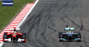 Nico Rosberg defends from Fernando Alonso
