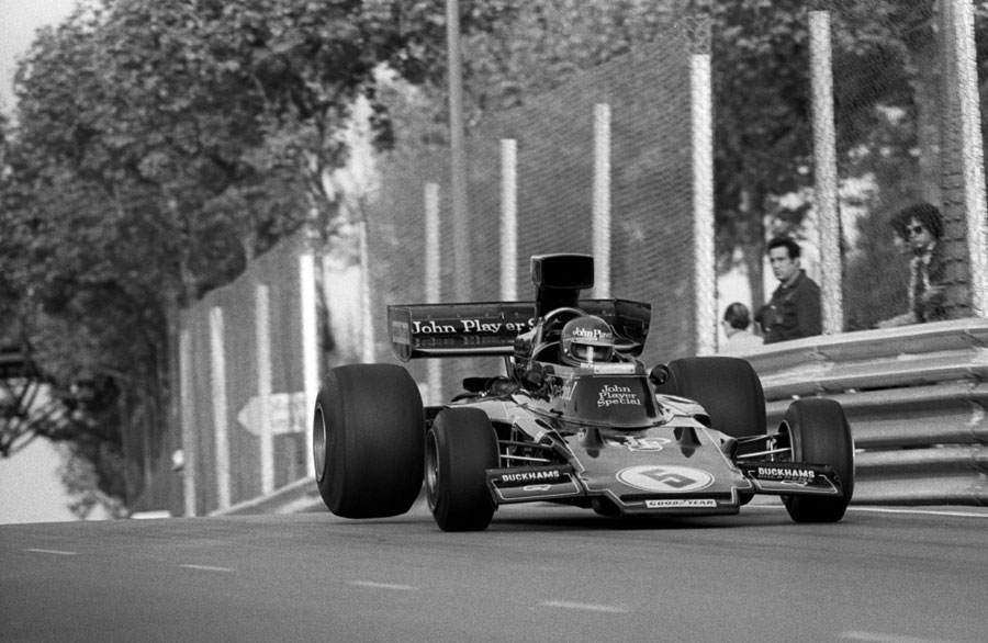 Ronnie Peterson takes on the jump midway down the pit straight