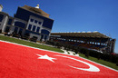 A Turkish flag painted on a lawn outside the pit and paddock buildings