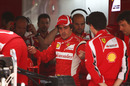 Fernando Alonso talks to his engineers on Thursday