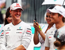 Michael Schumacher and Nico Rosberg share a joke on the grid