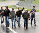 Bernie Ecclestone leads a track walk of the newly-renovated Red Bull Ring