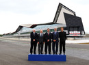 British world champions pose for a photo at the official opening of the new £27 million pit and paddock complex