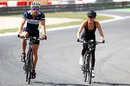 Jenson Button cycles the circuit with girlfriend Jessica Michibata