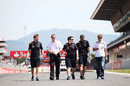 Sebastian Vettel walks the track with his team on Thursday