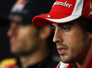 Fernando Alonso talks to the media during a press conference