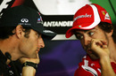 Mark Webber and Fernando Alonso chat during the press conference