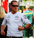 Michael Schumacher jogs through the paddock