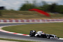 Rubens Barrichello speeds down the hill from turn five